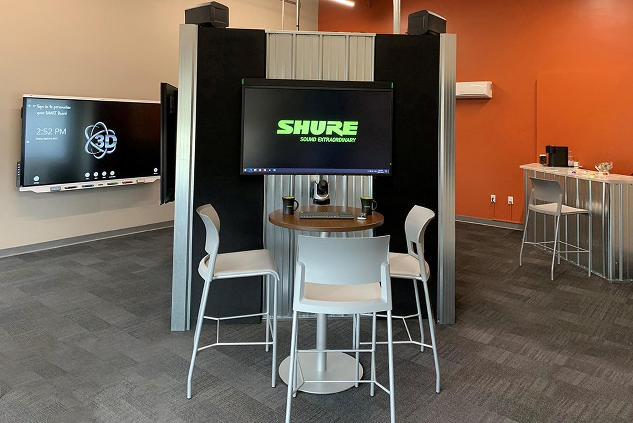 a room with a tv and a table and chairs